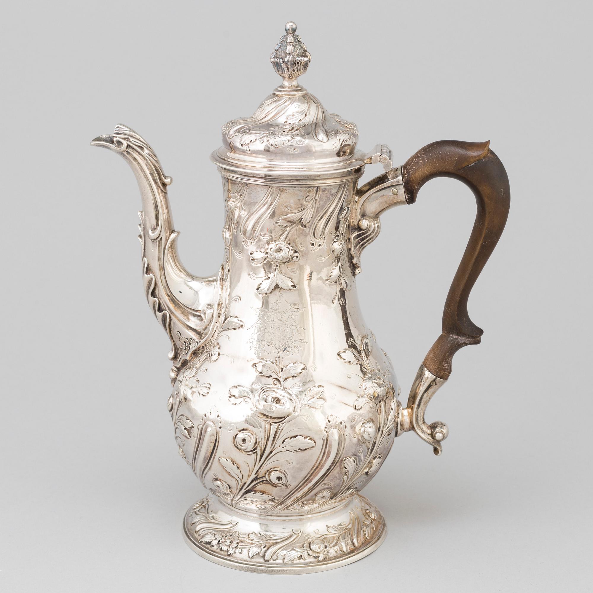 An English 18 th century silver coffee-pot, mark of Benjamin Gignac, London 1763.