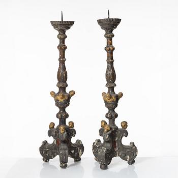 A pair of Baroque style candleholders, 19th Century.