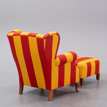 A 20th century easy chair and late 20th century stool.