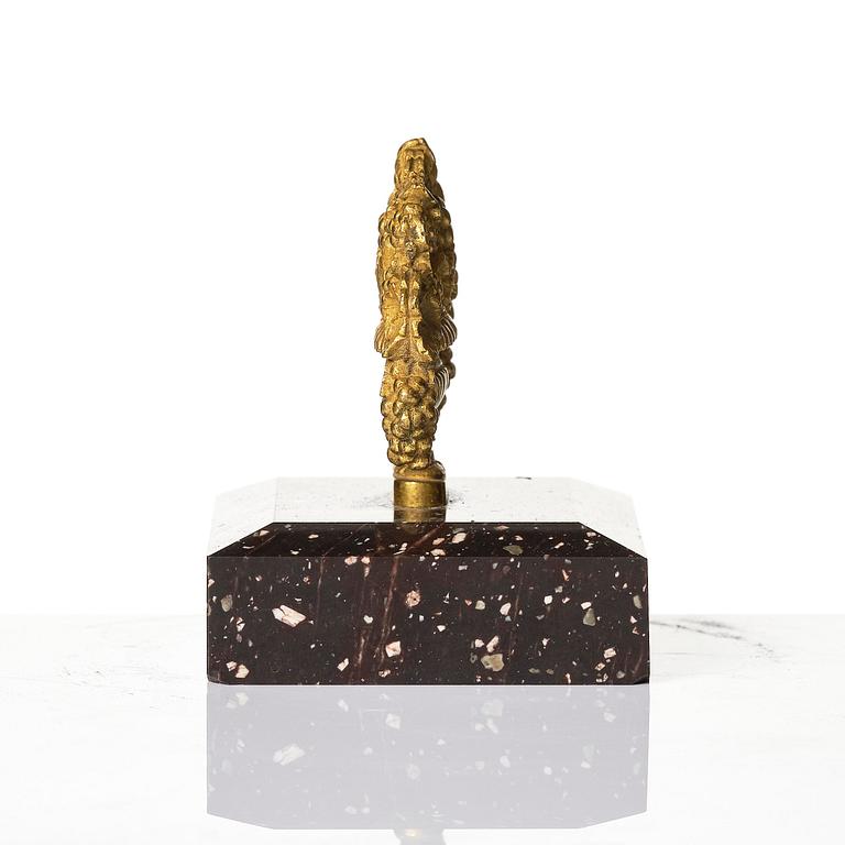 An Empire 'Loka-Risberg'-porhyry and ormolu paperweight, Älvdalen, early 19th century.