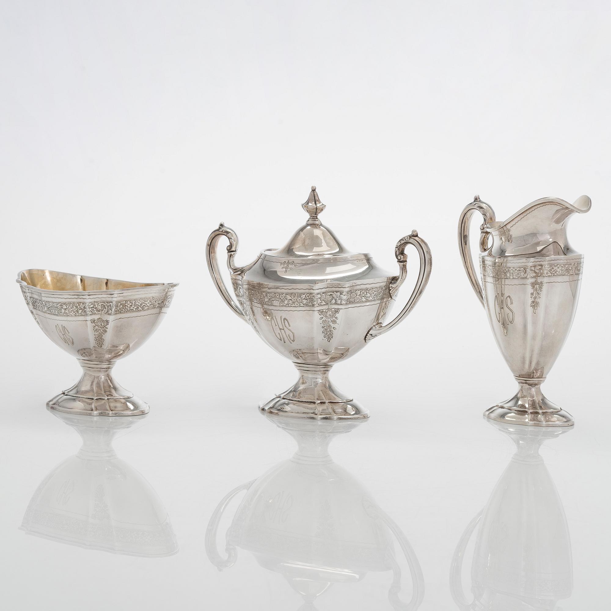 A five-piece sterling silver coffee and tea service, and 12 spoons, USA, first quarter of the 20th century.