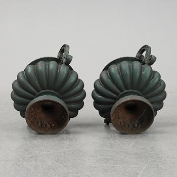 A 20th Century pair of cast iron flower pots.