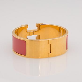 ARMBAND, bijouteri, Hermès "clic H", guldfärgad metall.