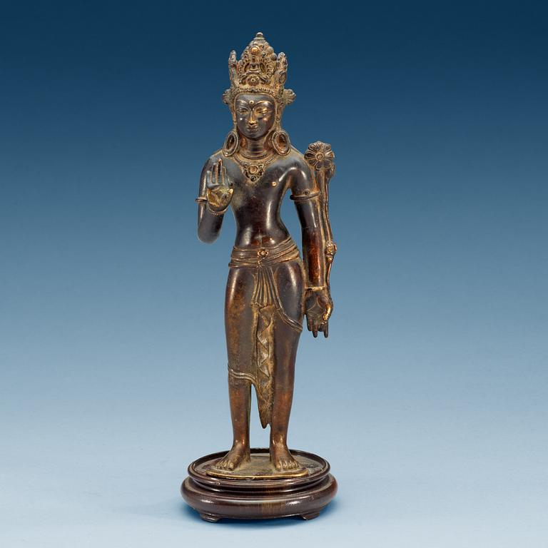 A Sino-Tibetan bronze figure of Padmapani, standing in slight tribhanga pose, 18th Century.