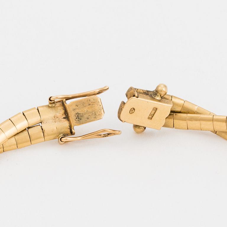 A two-rowed Omega link bracelet.