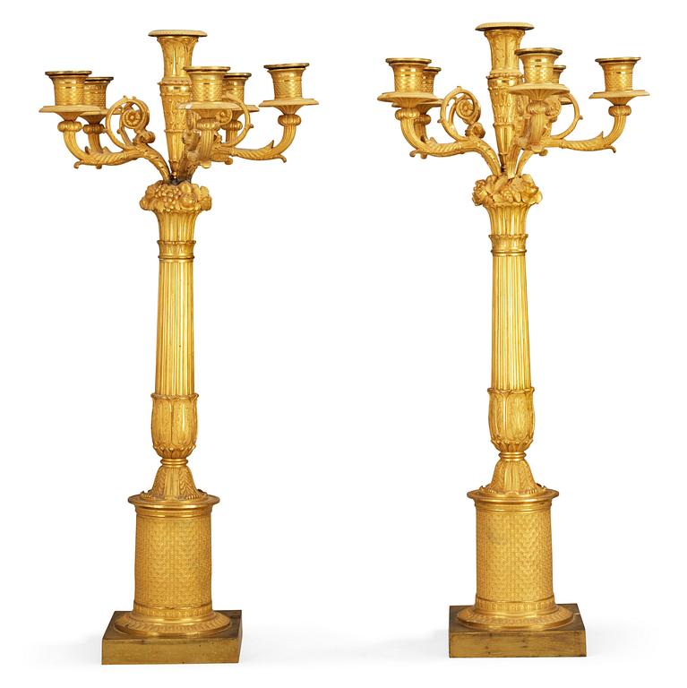 A pair of French Empire early 19th century six-light candelabra.