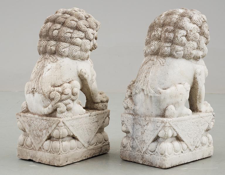 A pair of marble figures of 'Buddhist Lions', China.