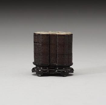 A three tiered wooden silver-inlayed box with cover, Qing dynasty.