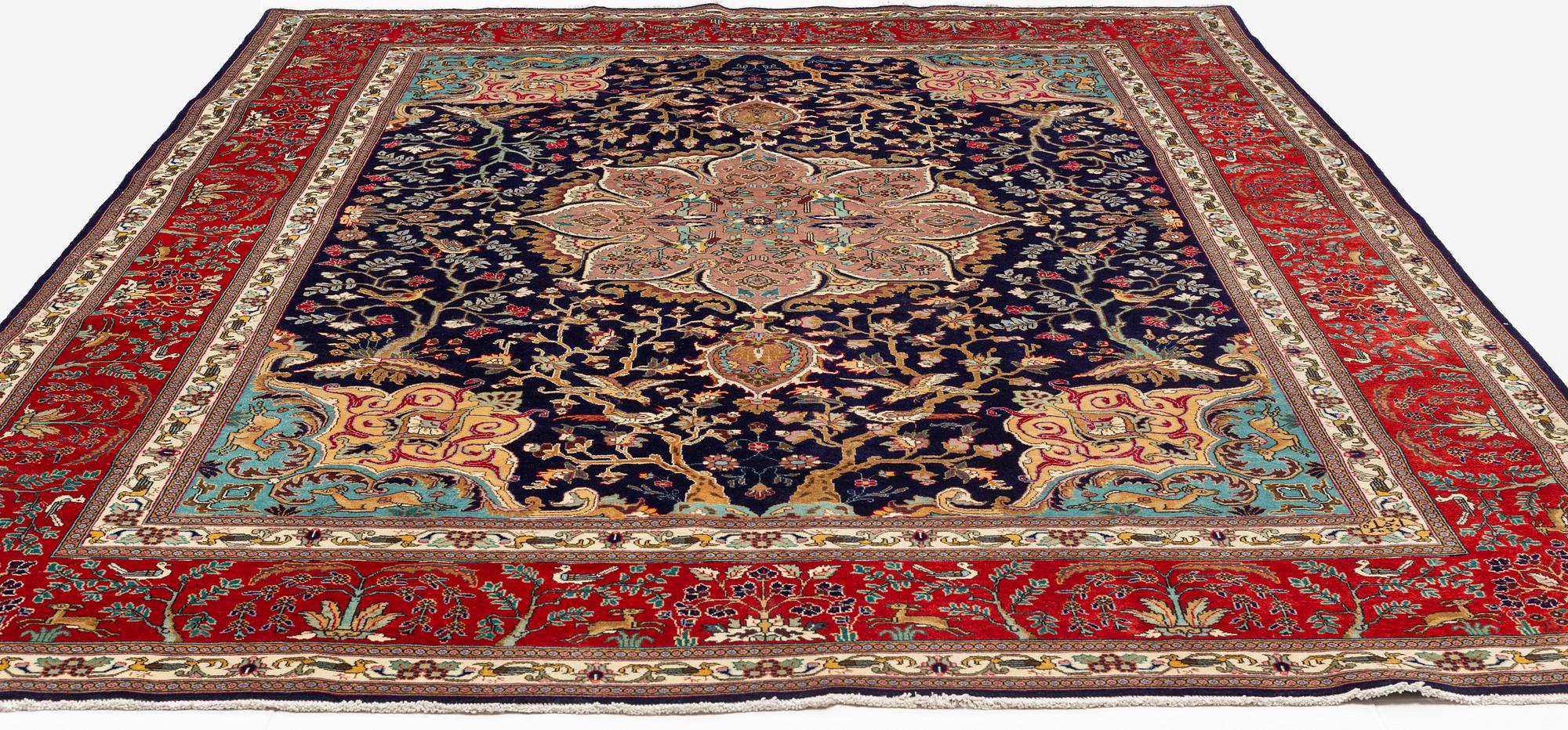 A carpet, Tabriz, signed Ipchilar, ca 385 x 280 cm.