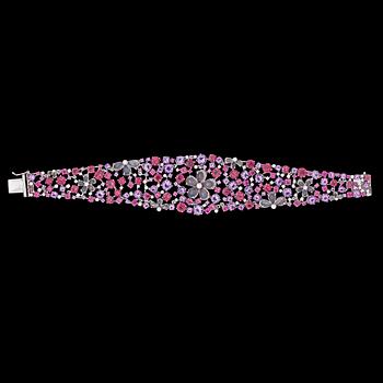 1028. A multi coloured precious stone and brilliant cut diamond bracelet.