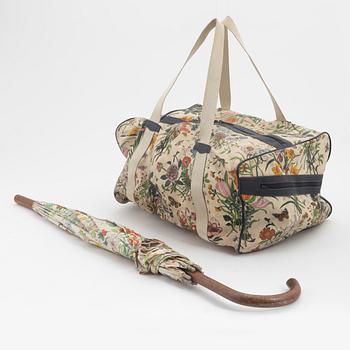 Gucci, a 'Flora' weekend bag and umbrella.