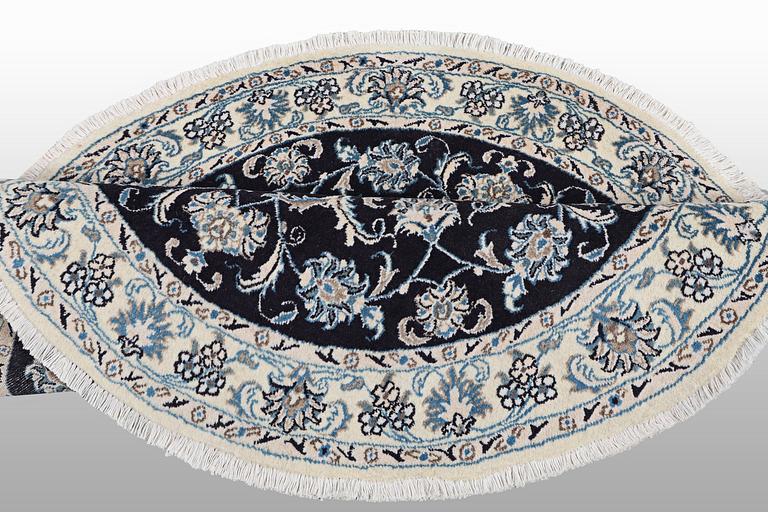 A rug, Nain, part silk, ca 140 x 140 cm.