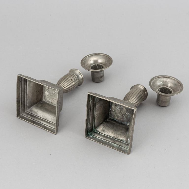 Two pairs of Swedish pewter candlesticks by Erik Wikgren, possibly and Nils Silov, first half of the 19th century.