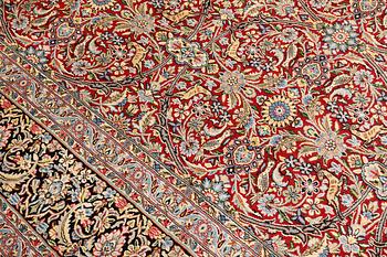 A Kirman Laver carpet, 'Millefleur', approx. 403 x 304 cm.