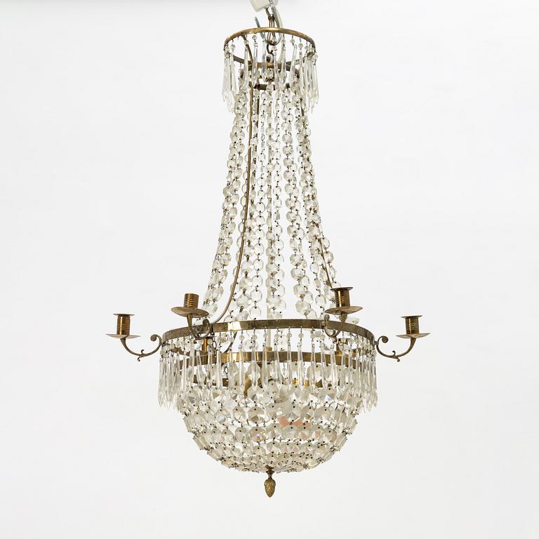 An Empire-style six-branch chandelier, circa 1900.