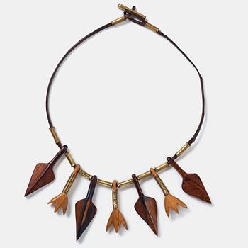 181. Vivianna Torun Bülow-Hübe, a leather necklace with brass and carved wooden details, Stockholm ca 1948.