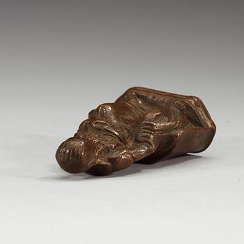 A seated copper-alloy figure of a the God of War, Guan Di, Ming dynasty (1368-1644).