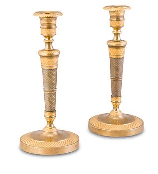 19. A PAIR OF ORMOLU CANDLESTICKS.