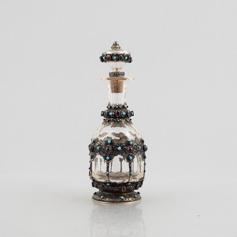 Flask with stopper, glass with mounts of partially gilded silver, late 19th century.