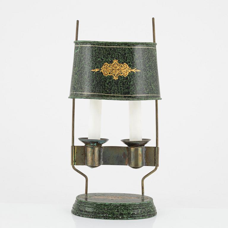 An empire style candlestick, circa 1900.