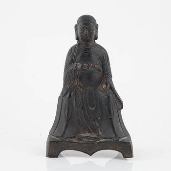 A bronze sculpture of a seated deity, Ming style, probably 20th Century.