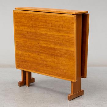 A mid 20th Century gate-leg table.