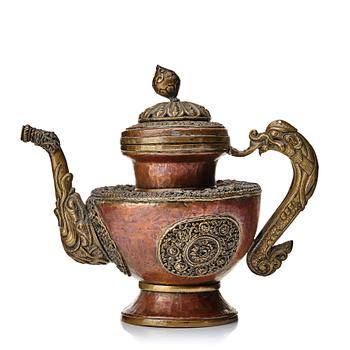 943. A Tibetan copper and brass pot with cover, 19th Century.