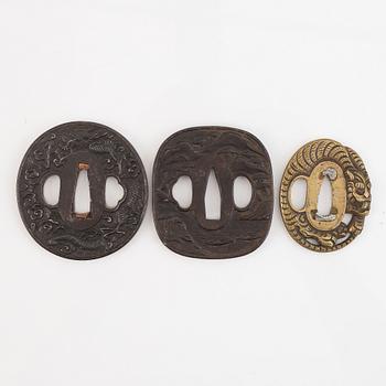 Five tsubas, iron and brass, Edo/Meiji period.