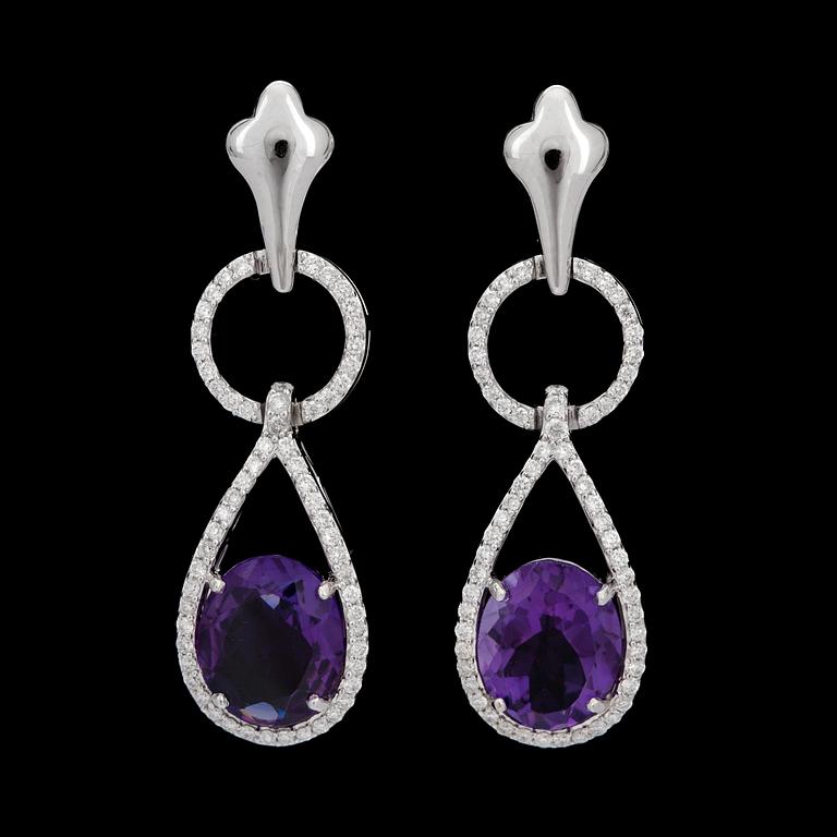 A pair of amethyst and diamond earrings. Amethysts 3.96 cts. Diamonds 0.62 ct.