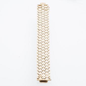 A 14K gold bracelet.