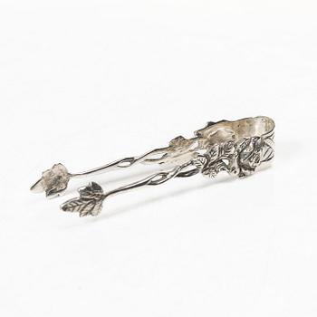 Two creamers, a tray, and a sugar tongs, silver, Rococo and Rococo style, 18th-19th century.