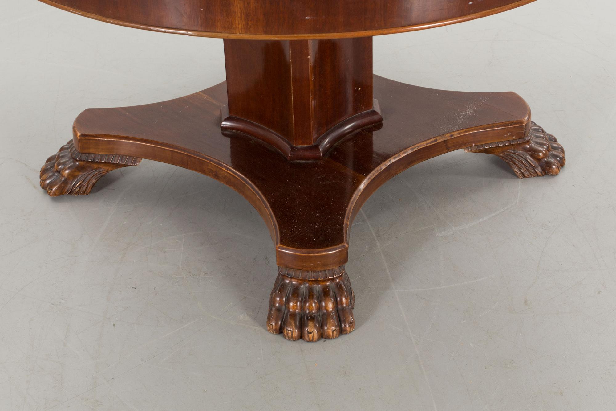 AN EMPIRE STYLE TABLE FROM AROUND 1900.