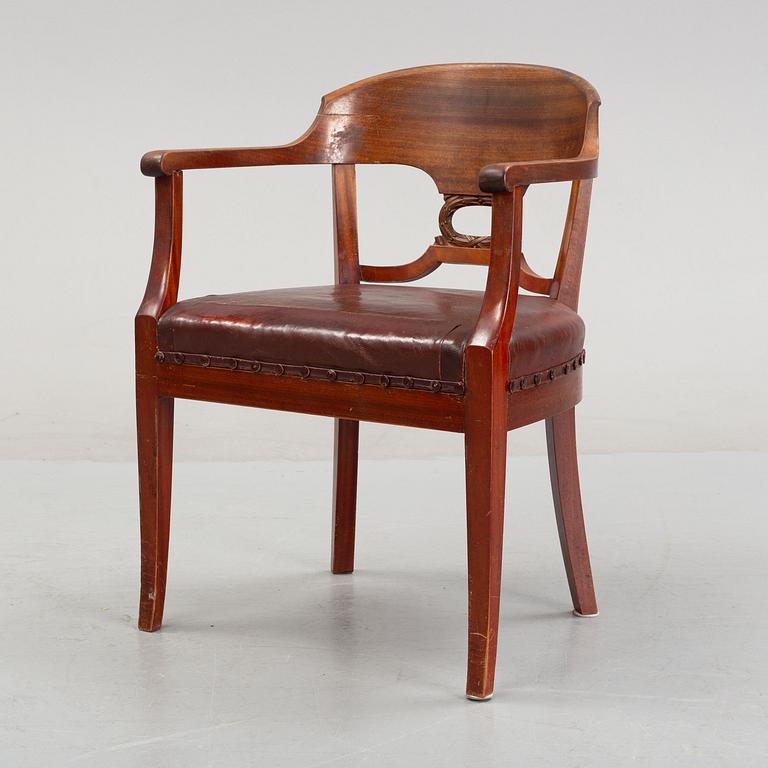 An Empire style writing desk, first half of/mid 20th century, and an Empire style chair, early 20th century.