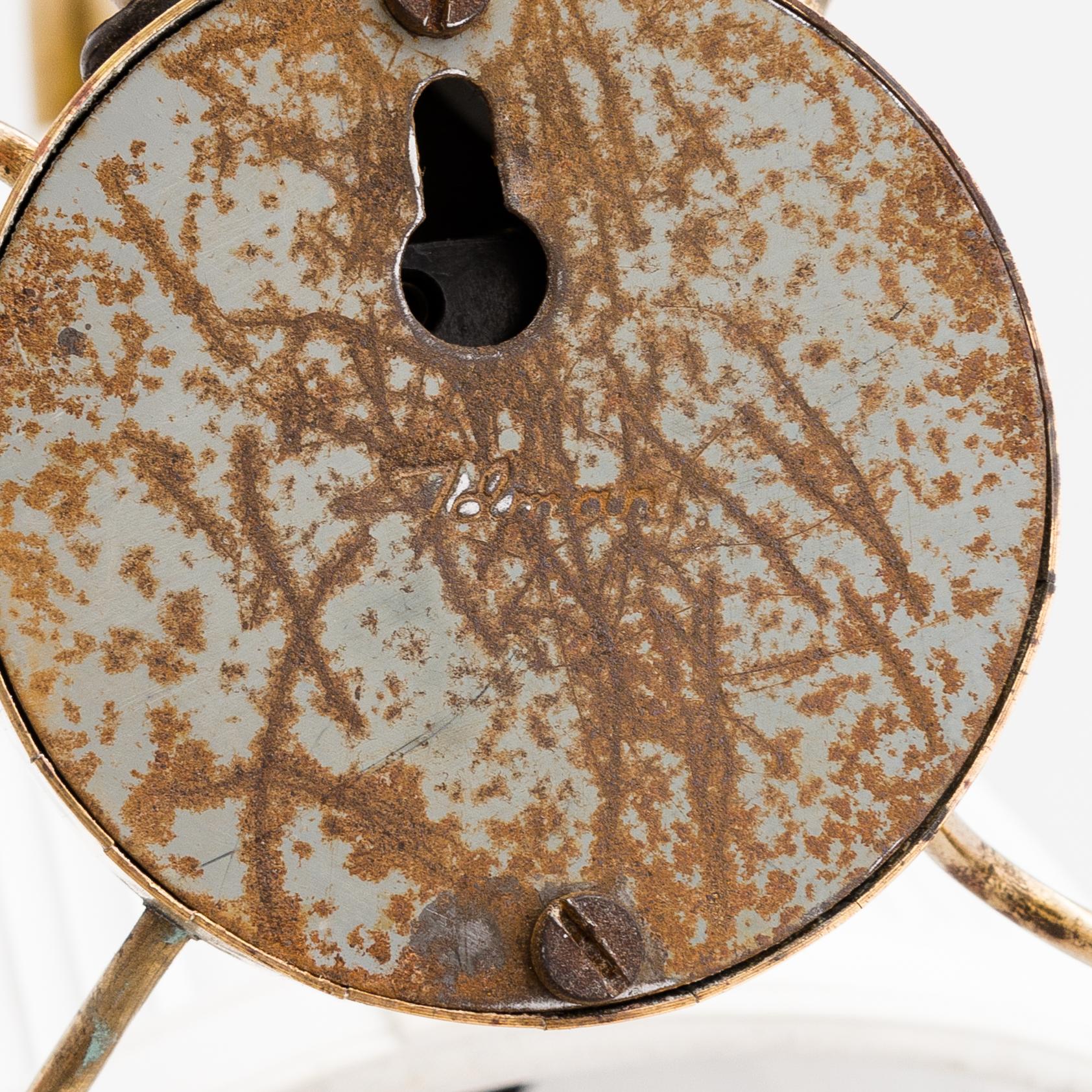 A mid-20th-century table lamp
/wall light for Idman.