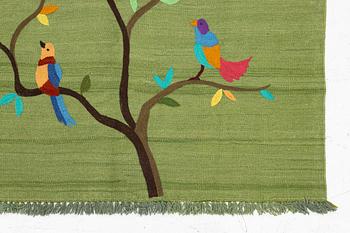 A hand-embroidered Kelim rug, 184 x 124 cm.