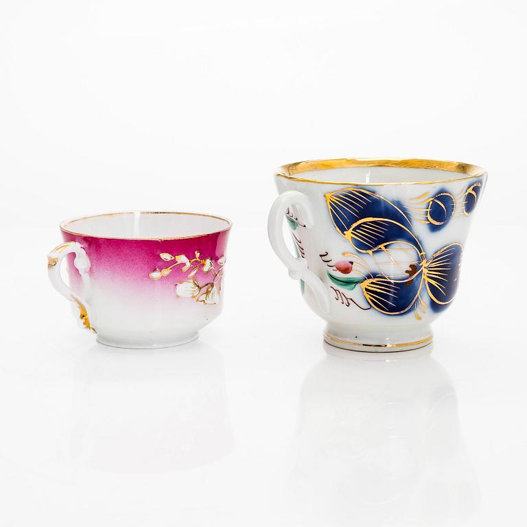 A 2-pcs set of porcelain cups with saucers, Kuznetsov and two plates, Gardner, various years 1880-1917.