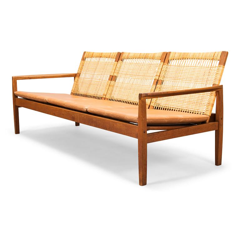 Hans Olsen, A teak and rattan sofa for Juul Kristensen, Denmark, late 1950s.