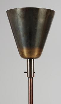 A 1930's-50's patinated metal floor lamp.