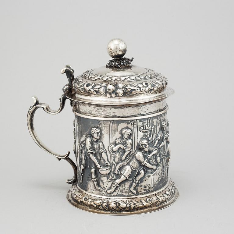 A silver baroque style tankard.