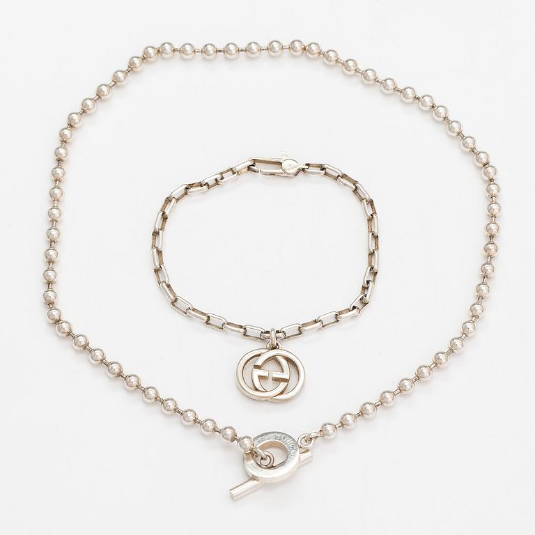 Gucci, A pair of earrings, bracelet, ring and necklace made of sterling silver. Marked Gucci, Made in Italy.