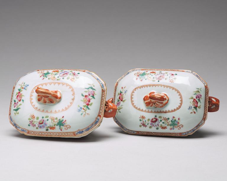 A pair of famille rose 'double peacock' butter tureens with cover and stand, Qing dynasty, Qianlong (1736-95).