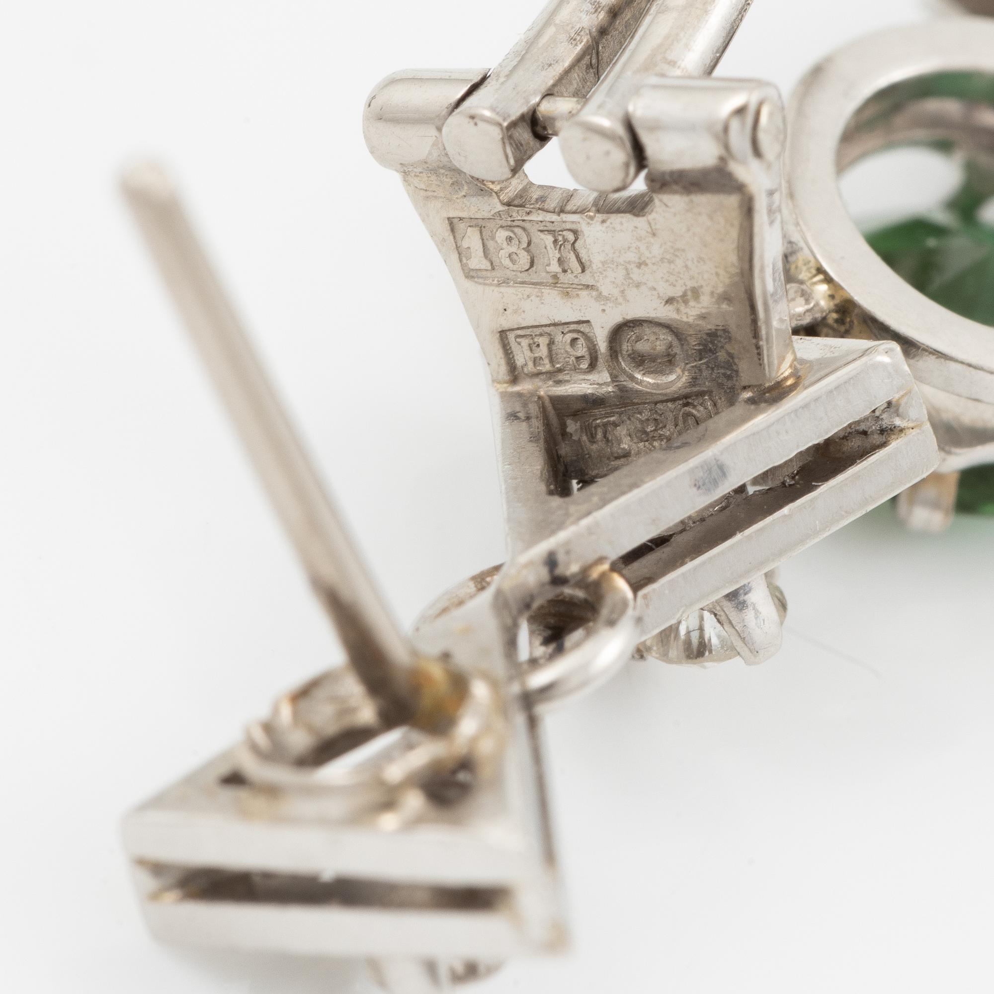 A pair of earrings in 18K white gold with tourmalines and round brilliant-cut diamonds.