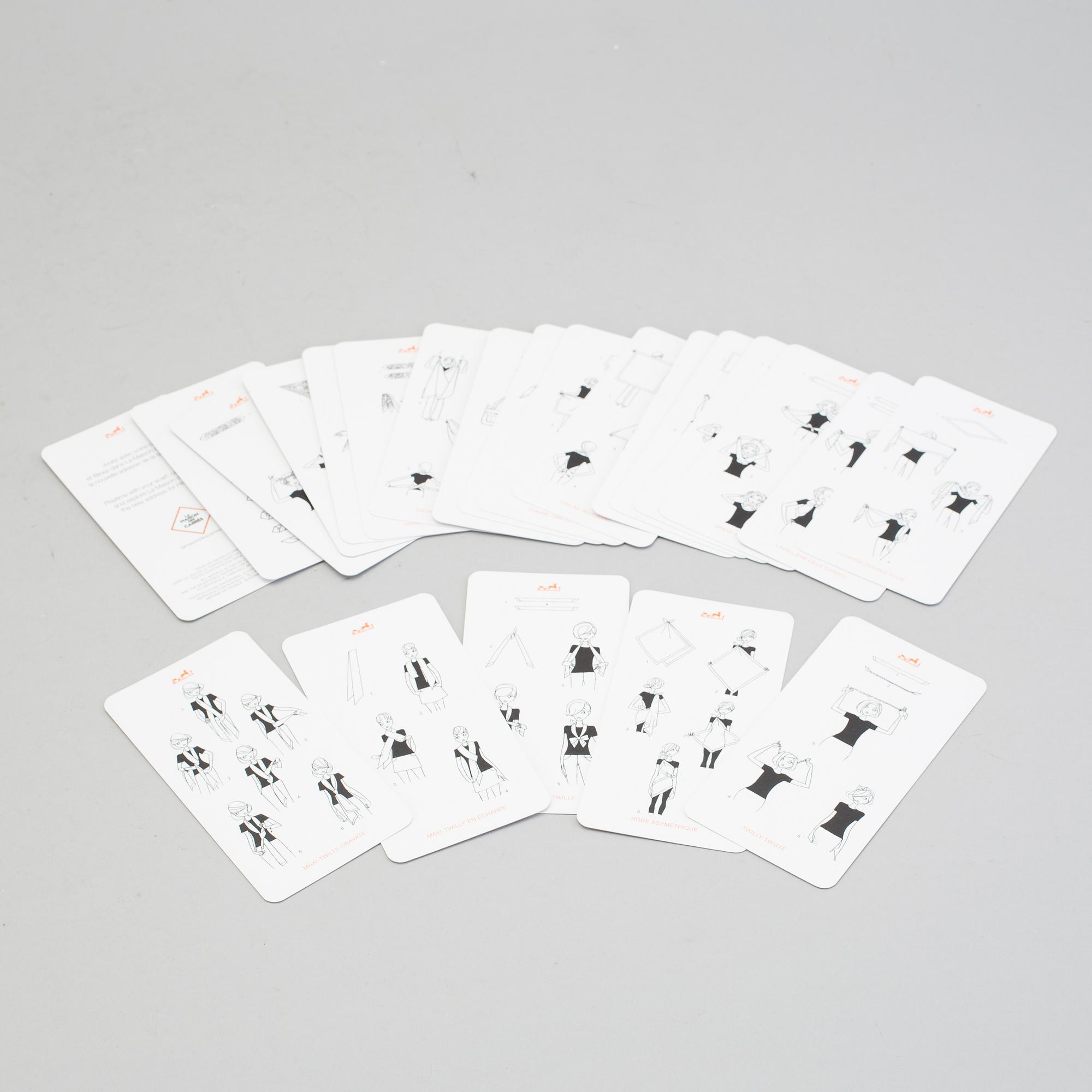 KNOTTING CARDS, "Cartes À Nouer", Hermès. Kort i originaletui med 21 olika sätt att knyta Hermès-scarfar på.