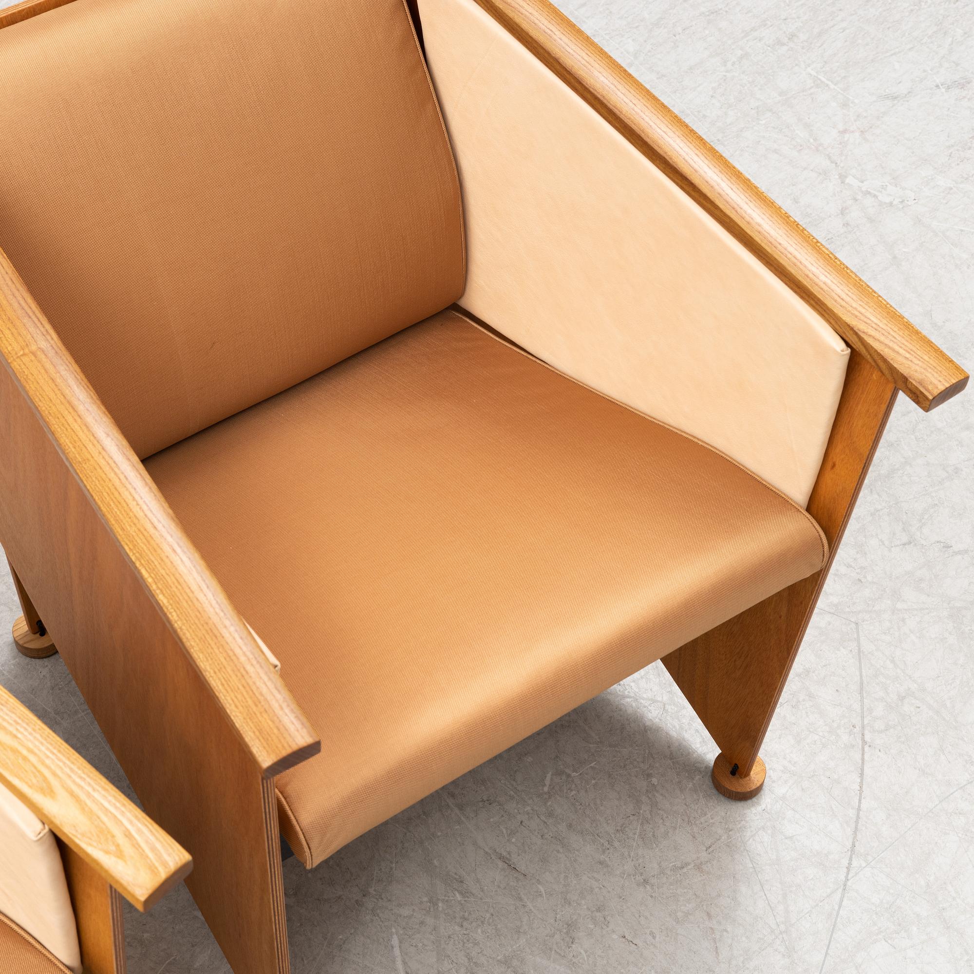 Torbjörn Ahlström, a pair of elm and cherry armchairs.