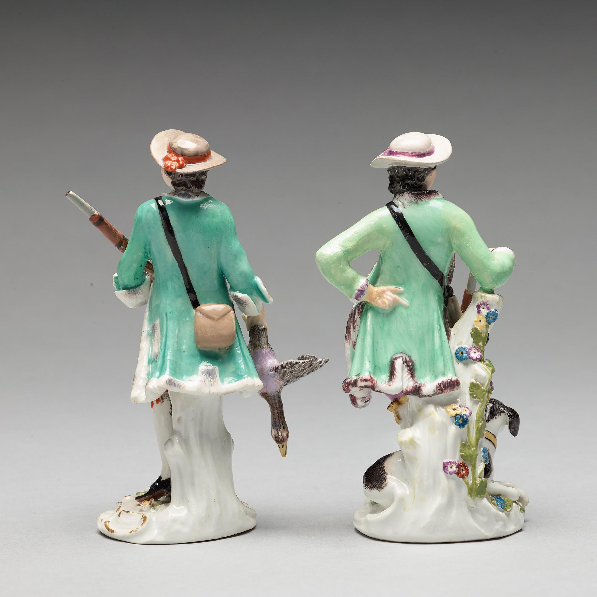 Two Meissen porcelain figures of huntsmen, 18th Century.