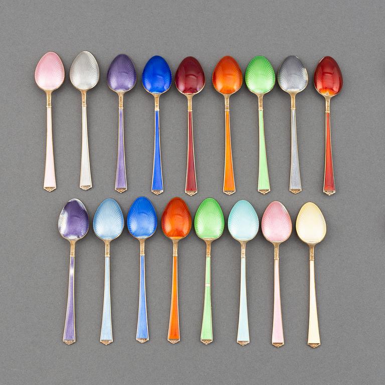 A mixed lot of 35 silver spoons, a tea strainer and two small dishes, parcel-gilt guilloché enamel, Norway, 20th century.