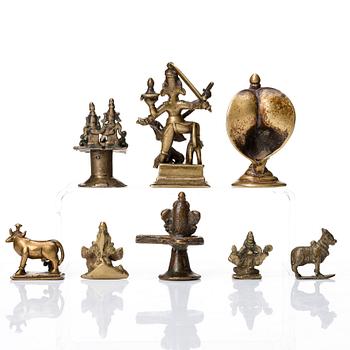 A group of eight brass miniatures, India, 19th/20th Century.