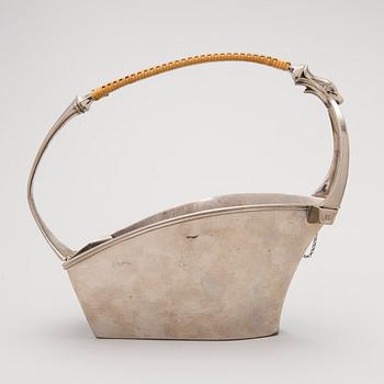 A metal wine bottle stand from WMF, Geislingen, Germany first half of the 20th Century.