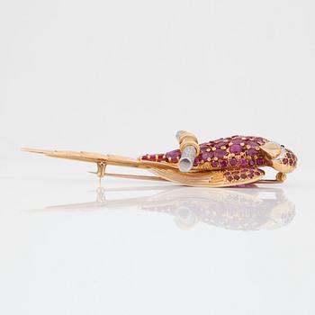 A ruby and single-cut diamond brooch in the shape of a parrot.