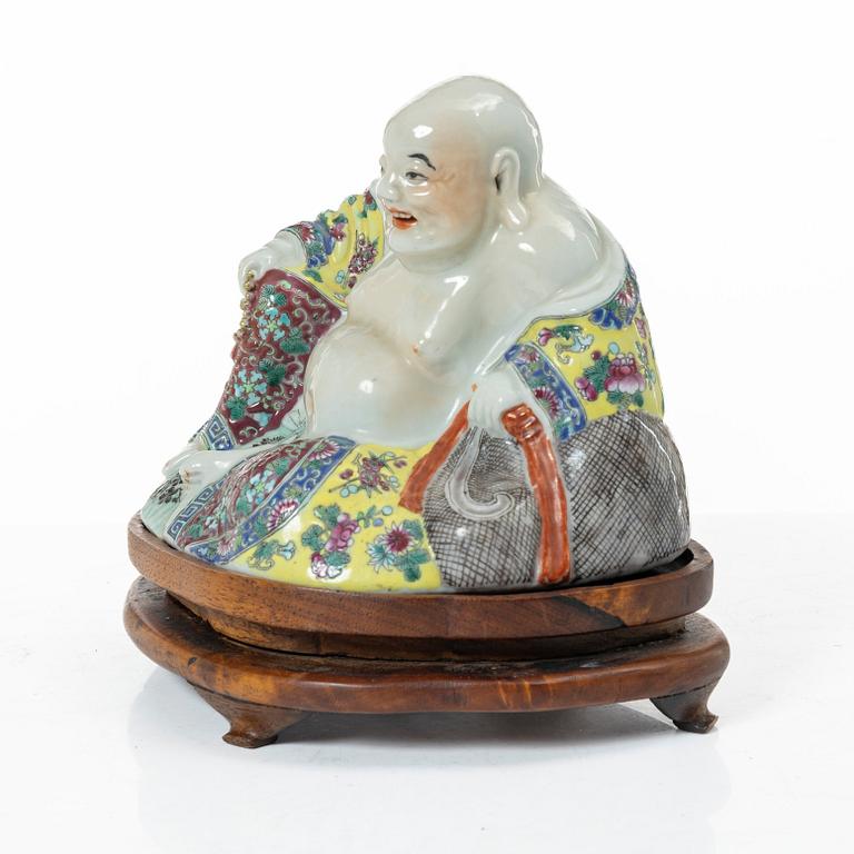A Chinese famille rose porcelain figure of a Budai, around 1900.